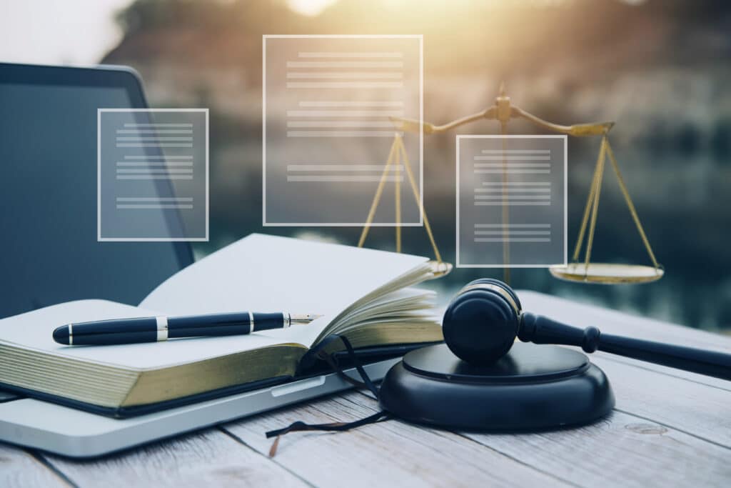 business lawyers discussing contract papers with brass scale desk office law legal services advice justice law concept picture with film grain effect