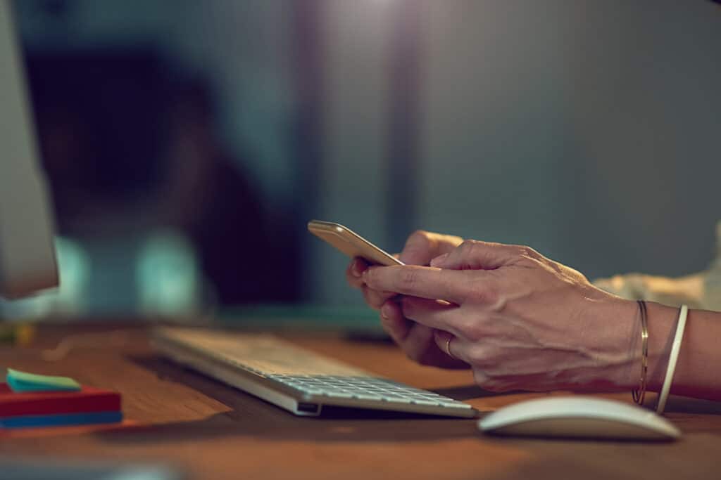 hands business woman with smartphone night typing with connection internet social media person evening human resources with cellphone answer email digital app with contact